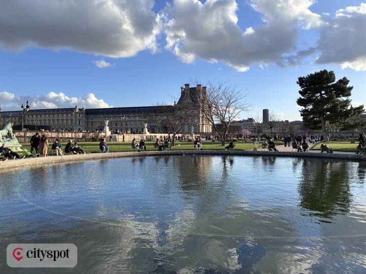 The pond of the Tuileries Garden — with the Louvre beyond
